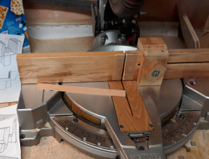 Cutting thin piece of wood on a miter saw with custom fence